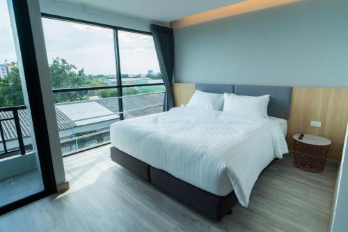 Ένα ή περισσότερα κρεβάτια σε δωμάτιο στο Goodday Hotel