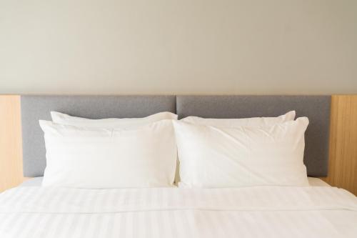 Ένα ή περισσότερα κρεβάτια σε δωμάτιο στο Goodday Hotel
