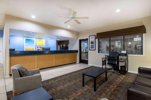 a lobby with a waiting room and a bar at Days Inn by Wyndham Roswell in Roswell