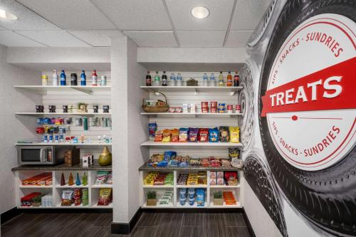 a fast food restaurant with aries sign and shelves of food at Hampton Inn & Suites Phoenix North/Happy Valley in Phoenix