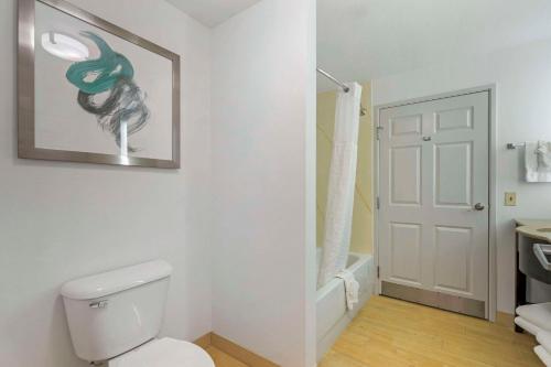 a bathroom with a white toilet and a sink at Comfort Inn & Suites Port Charlotte-Punta Gorda in Port Charlotte