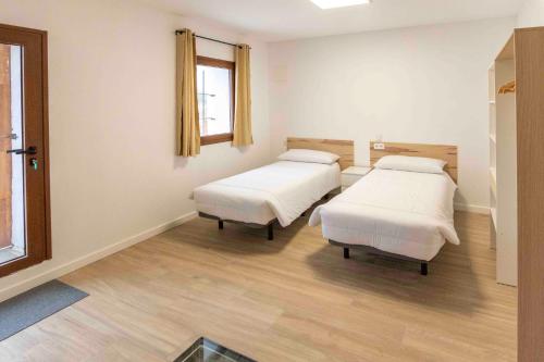 Postel nebo postele na pokoji v ubytování Apartamento Casa Borderías