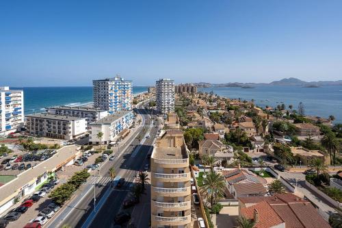 una vista aérea de una ciudad con el océano en Poseidon La Manga Hotel & Spa - Designed for Adults, en La Manga del Mar Menor