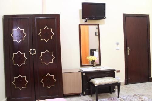 a bathroom with a mirror and a vanity and a mirror at City View Museum Hotel in Cairo