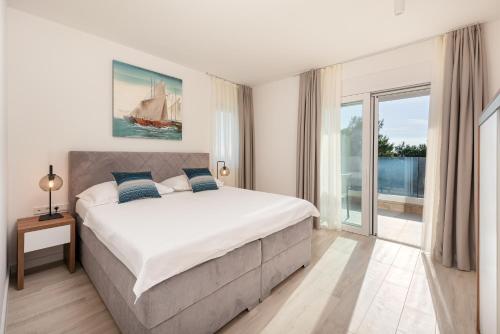 Ένα ή περισσότερα κρεβάτια σε δωμάτιο στο Luxury Apartments Promajna