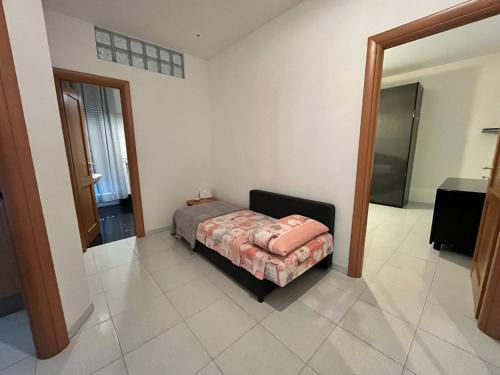 a bedroom with a bed and a mirror at Bridge's House - a 50 mt dalla spiaggia e da tutti i servizi! in Pescara