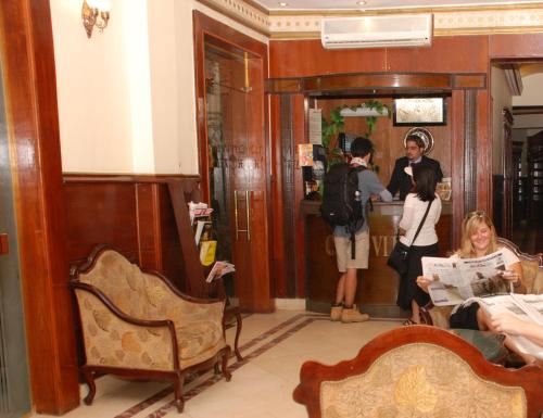a group of people standing in a room at City View Museum Hotel in Cairo