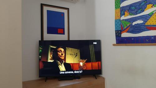 a flat screen tv sitting on top of a dresser at Villa White Sands - Private Oasis, Heated Pool, Beaches & Strip Nearby in Albufeira