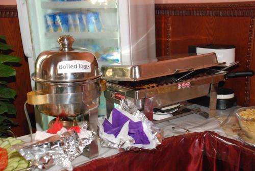 a food mixer sitting on a counter next to a refrigerator at City View Museum Hotel in Cairo