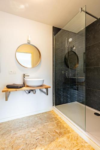 a bathroom with a sink and a shower at Le Gîtel in Spa