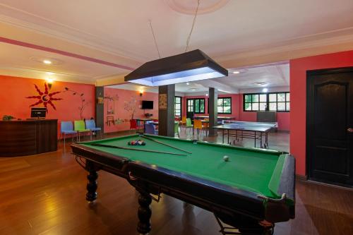 a living room with a pool table in it at Sterling Nainital in Nainital
