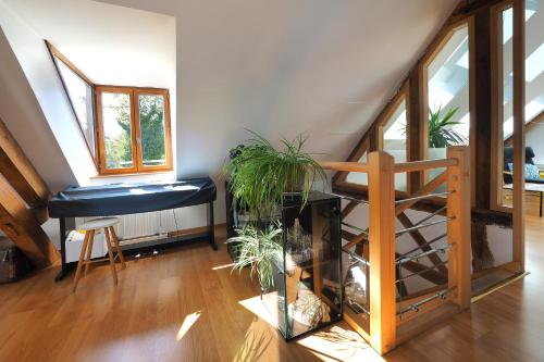 a living room with a fish tank and a staircase at Au Moulin de l'Andelle in Pitres