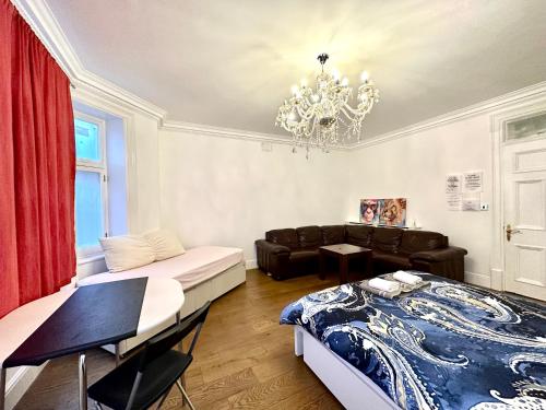 a living room with a bed and a couch at 1 Step to Station! Double Room in Marylebone&Paddington, Central , #room name is tokyo# in London