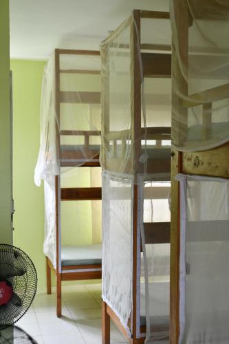 a couple of bunk beds in a room at Tulia House Backpackers in Mombasa