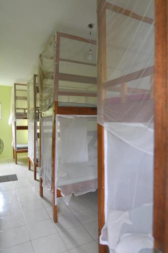 a group of bunk beds in a room at Tulia House Backpackers in Mombasa