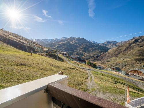 a view of the mountains from the balcony of a house at Apartment Les Origanes-2 by Interhome in Les Menuires