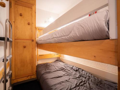 a small bedroom with a bunk bed in a tiny house at Apartment Sarvan 625 by Interhome in Les Menuires