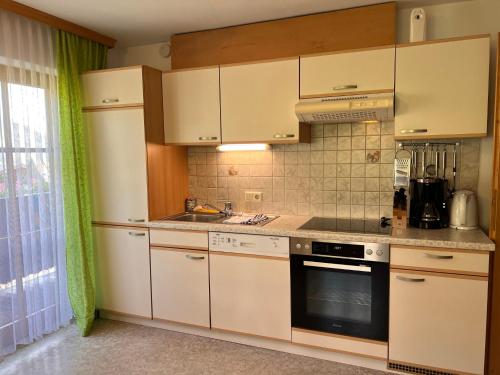 Η κουζίνα ή μικρή κουζίνα στο Apartment Bauernhof Gasteg - PID230 by Interhome