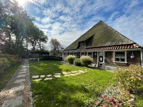 a house with a grass yard in front of it at Holiday Home De Dars by Interhome in Stolpen