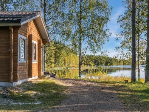 a cabin with a view of a lake at Holiday Home Sakarinniemi by Interhome in Kortteinen