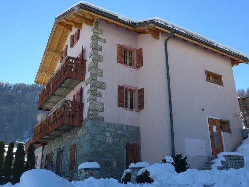 a house with snow on the ground in front of it at Holiday Home Le Dahu by Interhome in Nendaz