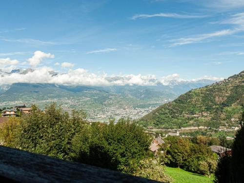 a view of a valley with mountains in the distance at Holiday Home Le Dahu by Interhome in Nendaz