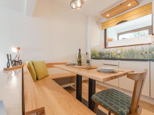 a dining room with a table and a chair at Apartment Hasennest by Interhome in Bad Hofgastein