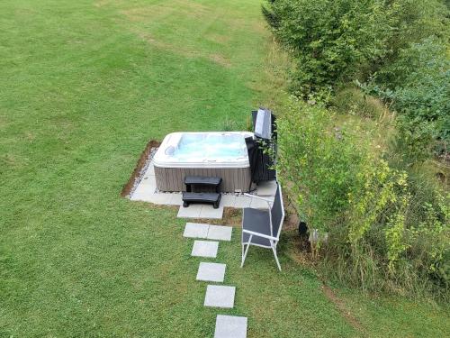 an overhead view of a hot tub and a table and chairs at Holiday Home Reiter by Interhome in Rohrbach