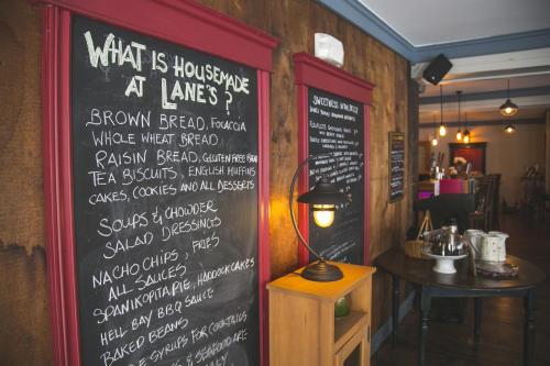 a chalkboard with a menu on the wall of a restaurant at Lanes Privateer Inn in Liverpool