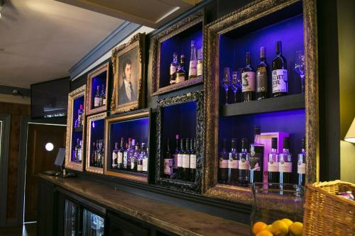 a bar with a bunch of bottles of wine at Lanes Privateer Inn in Liverpool