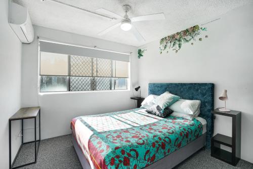 a bedroom with a bed and a window at Kings Ocean Views Private Rooftop in Caloundra