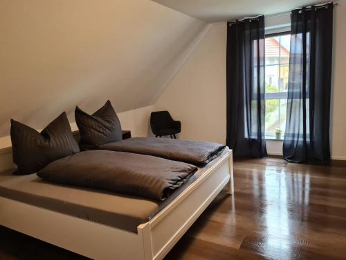 Säng eller sängar i ett rum på Ferienhaus Alpenblick
