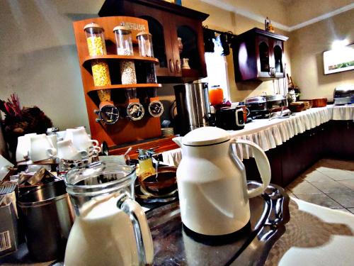 a kitchen counter with a jug of milk on it at Átrium Hotel Harkány in Harkány