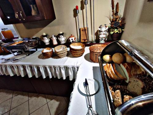 a table with a buffet of food on it at Átrium Hotel Harkány in Harkány