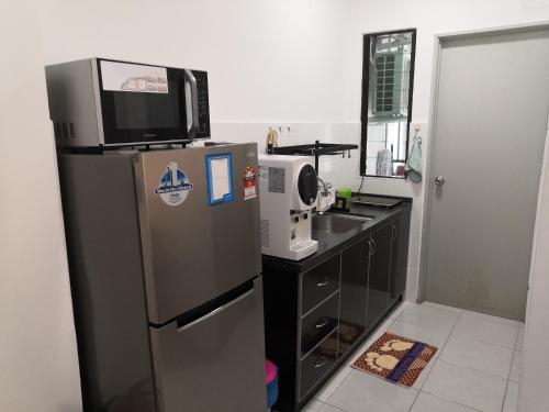 Kuchyň nebo kuchyňský kout v ubytování Hamin De Thor Homestay-Benoni Garden Apartment