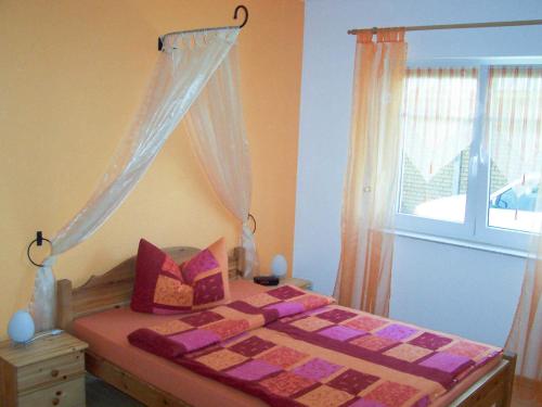 Postel nebo postele na pokoji v ubytování Ferienwohnung im Ostseeblick