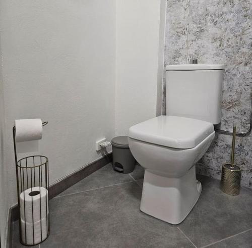 a bathroom with a white toilet in a room at Good Times Accomodation Cuneo in Cuneo