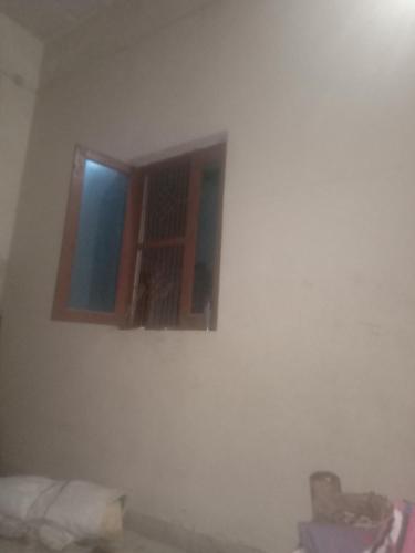 Un pat sau paturi într-o cameră la KATHWARI Homestay