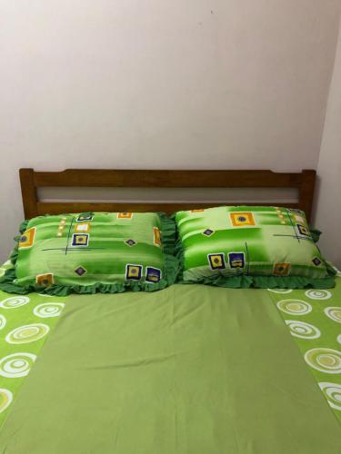 Ένα ή περισσότερα κρεβάτια σε δωμάτιο στο Cg Homestay
