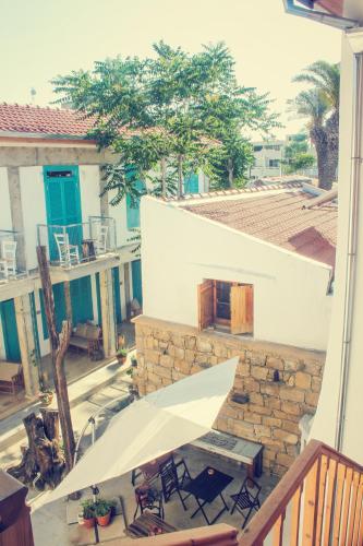 a patio with a table and chairs on a building at NICOSIA EAGLE EYE in North Nicosia