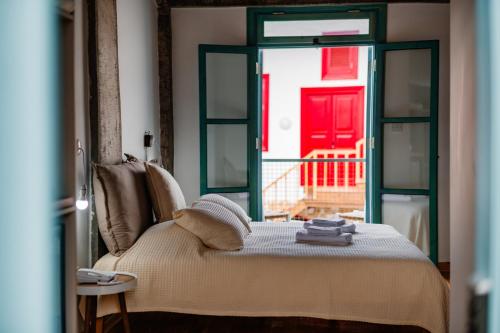 a room with a bed and a red door at NICOSIA EAGLE EYE in North Nicosia