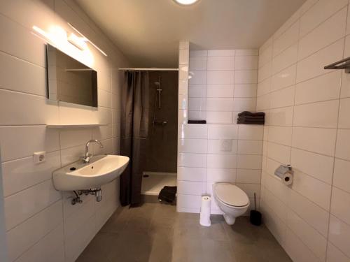a bathroom with a sink and a toilet at Short Stay Wageningen in Wageningen