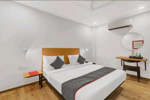 a bedroom with a large bed and a basketball hoop at Nilansh homes and hotels in Lucknow