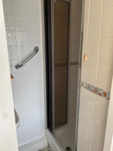 a bathroom with a shower with a glass door at The Hideaway!! Skegness ground floor room free parking in Skegness