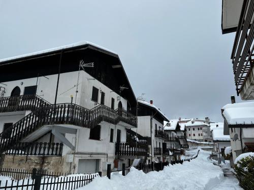 a building with stairs on it in the snow at IL RIFUGIO DI ETTORE in Campo di Giove
