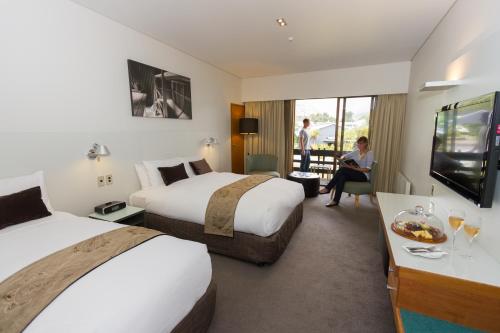 Ein Bett oder Betten in einem Zimmer der Unterkunft Scenic Hotel Franz Josef Glacier