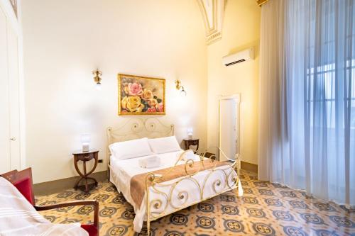 Ένα ή περισσότερα κρεβάτια σε δωμάτιο στο Palazzo Zacà