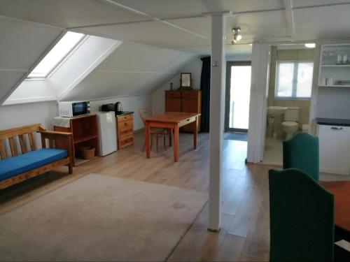 a kitchen and living room with a table and chairs at Latjeskloof Accommodation in Citrusdal