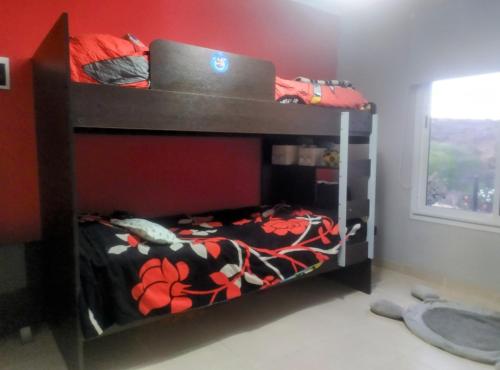 En eller flere senge i et værelse på Amanecer serrano