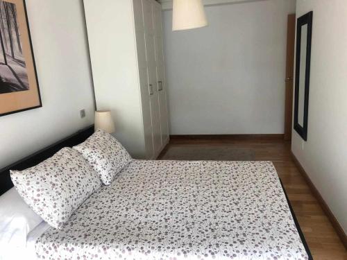 Кровать или кровати в номере Apartamento en Santoña
